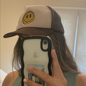 Brown smiley face trucker hat